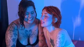 Watch this skinny redhead dominate and humiliate her food-loving lesbian partner in a dirty close-up of her belly and big tits